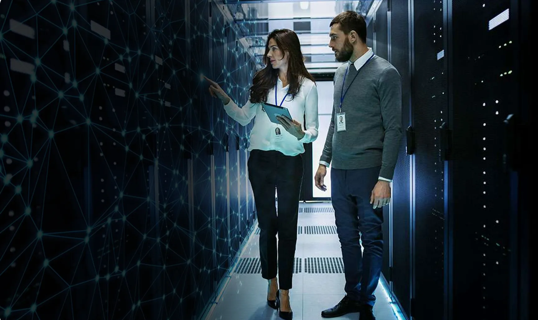Network engineer helping a CEO within a database center, going through their offerings and explaining the different types of infrastructure Zerati offers with the help of Oregon's E-Rate Program